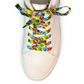 White sneaker with colorful tie-dye wizard laces on a white background