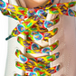Colorful wizard-patterned shoelaces on a white shoe.