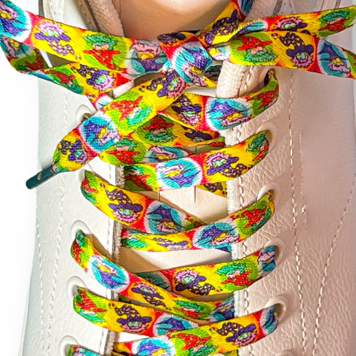 Colorful wizard-patterned shoelaces on a white shoe.