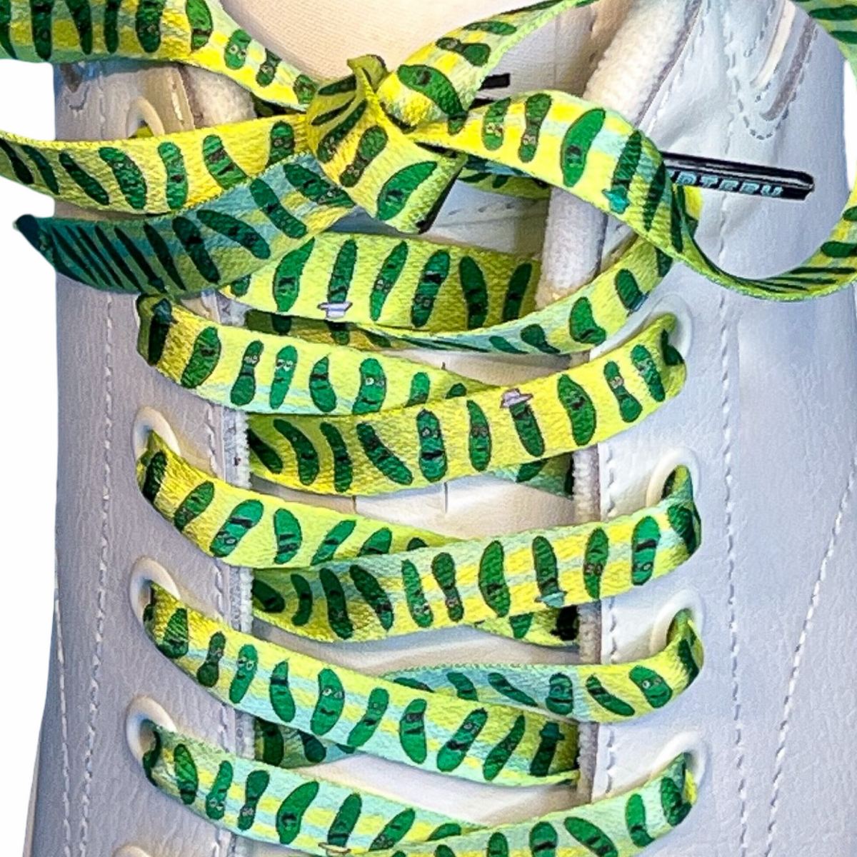 Green and yellow pickle patterned shoelaces on a white sneaker