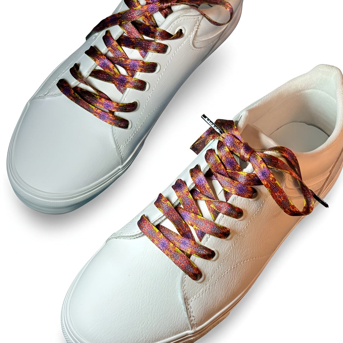 White sneakers with colorful laces on a white background