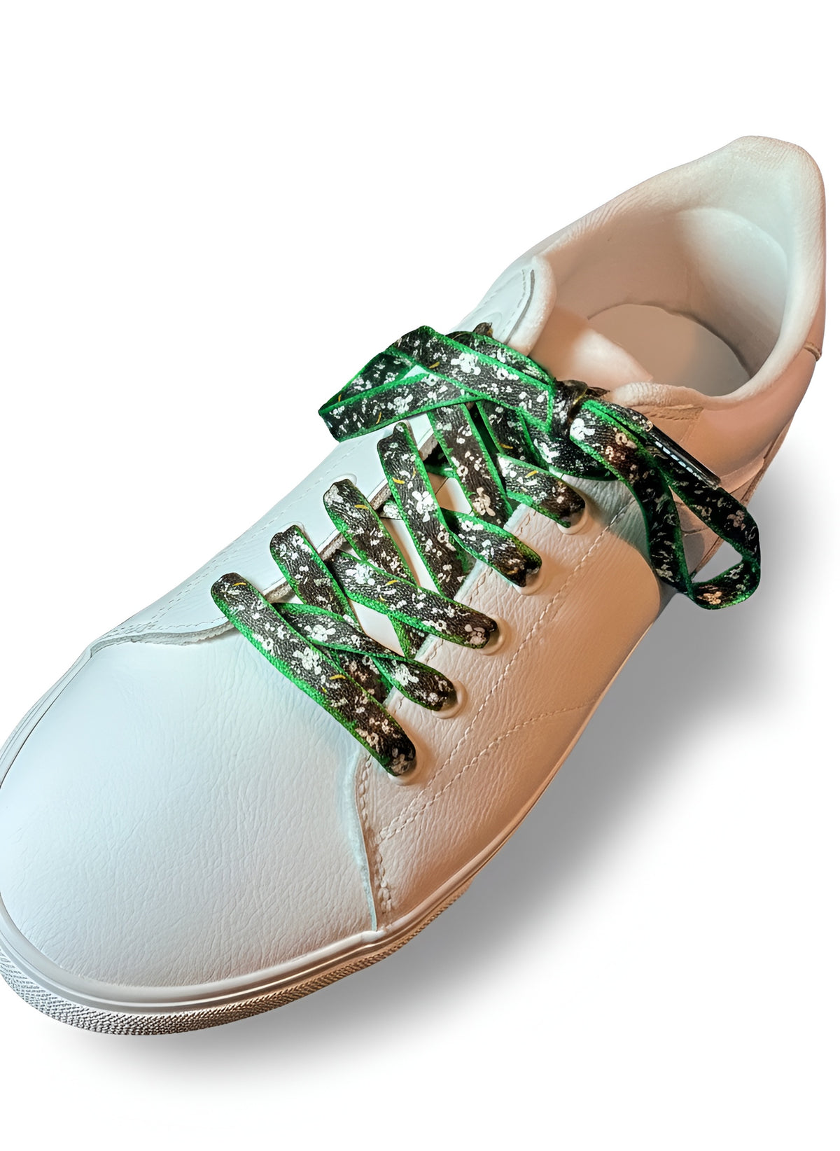 White sneaker with cow shoelaces on a white background