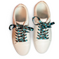 White sneakers with diamond patterned shoelaces on a white background