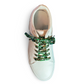 White sneaker with cow shoelaces on a white background