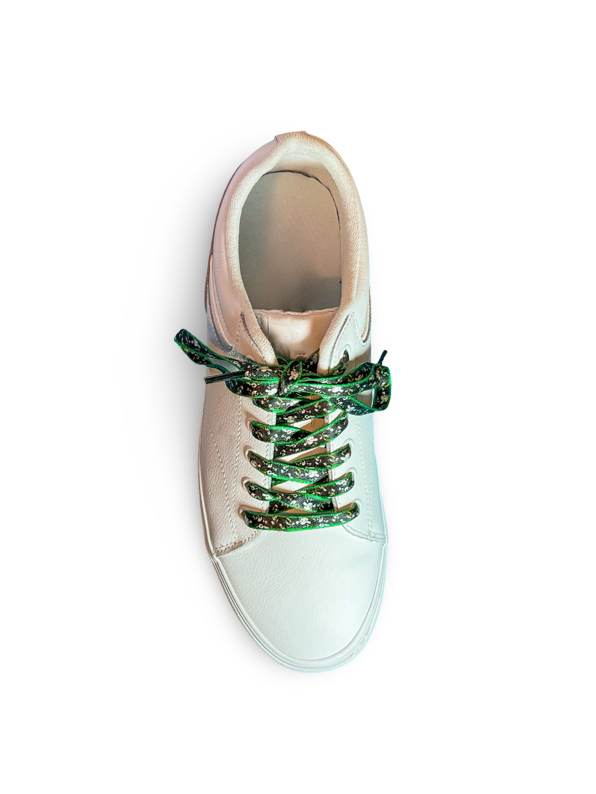 White sneaker with cow shoelaces on a white background