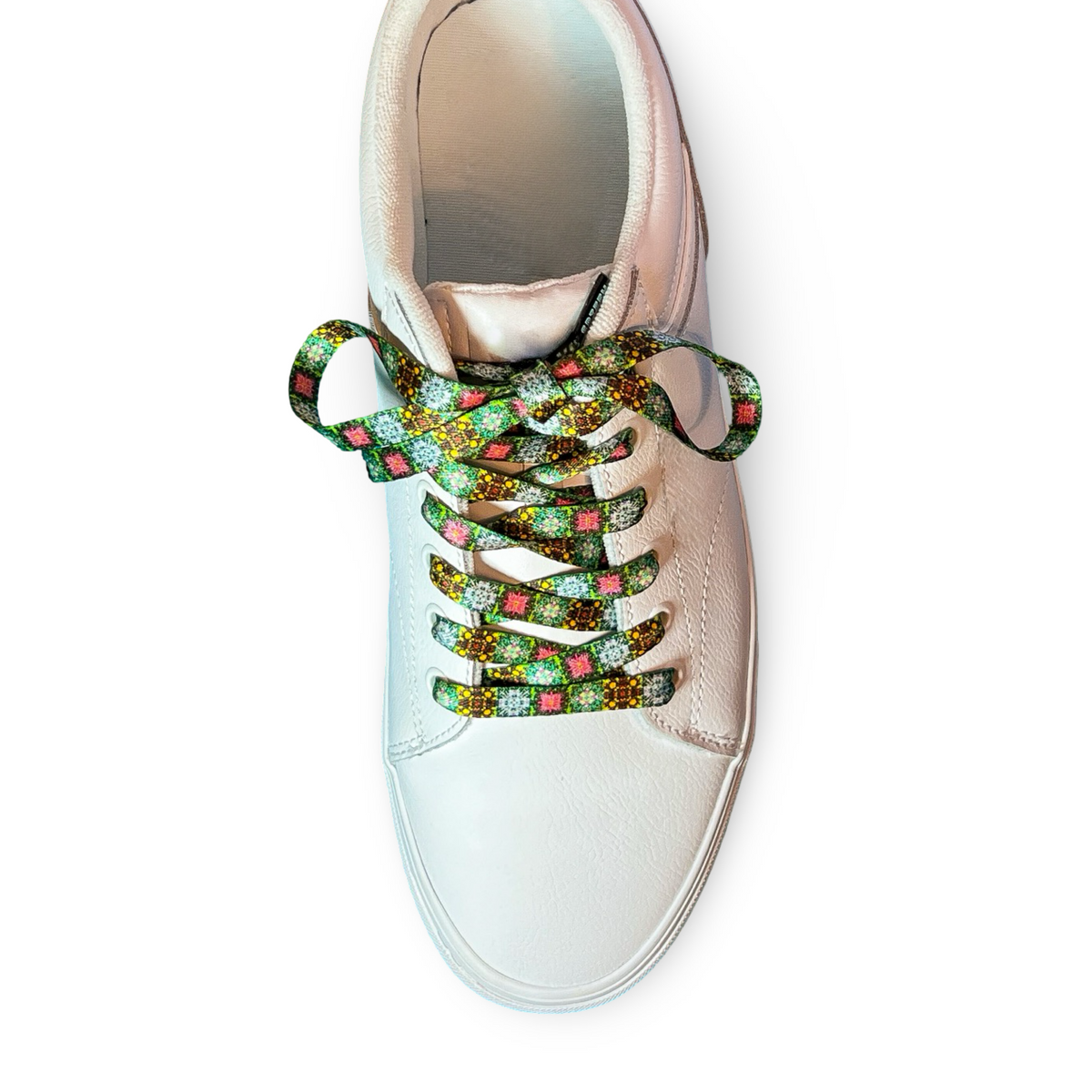 White sneaker with colorful printed laces on a white background