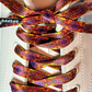 Colorful patterned shoelaces on a white sneaker