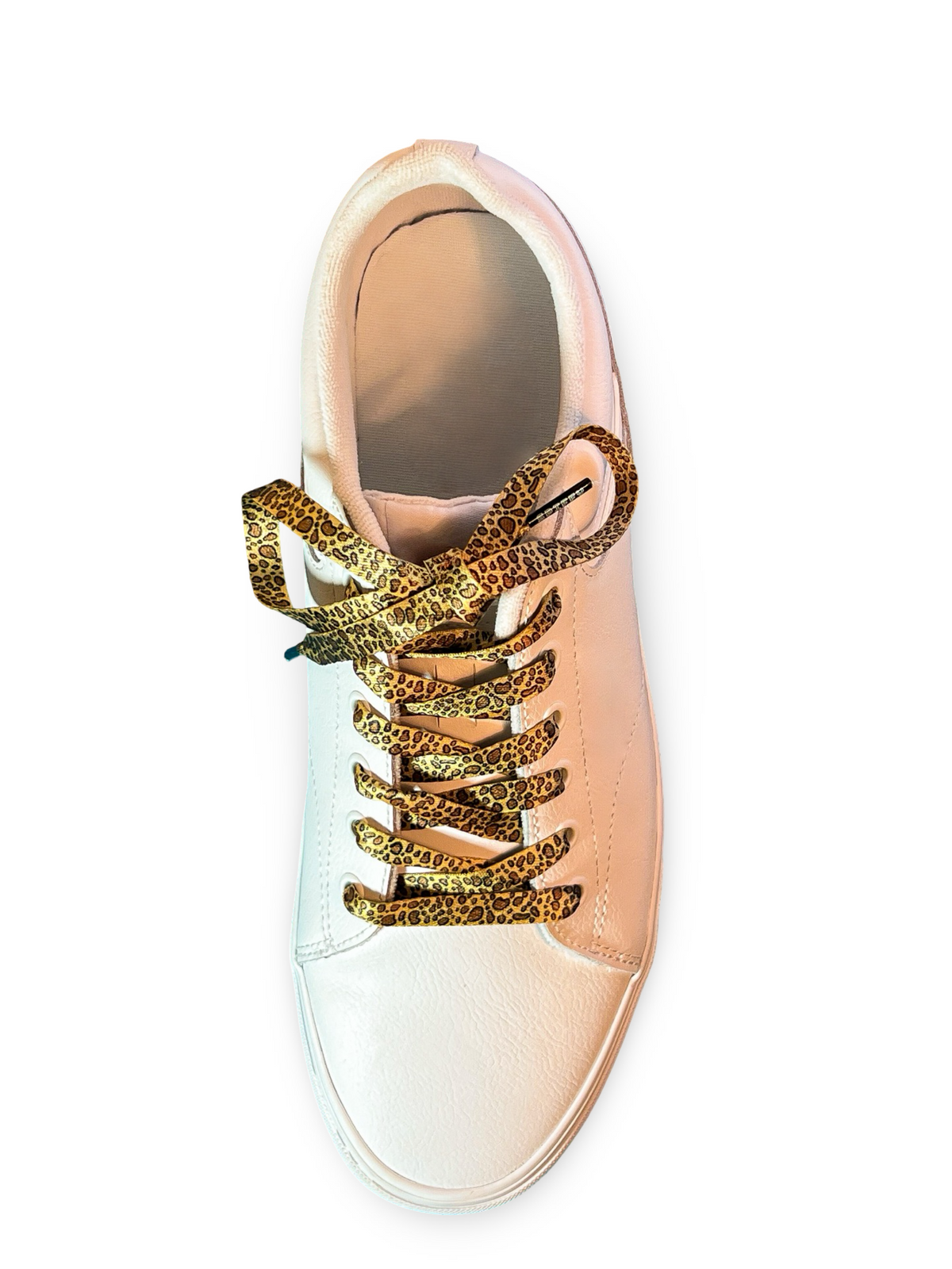Rose gold sneaker with leopard print shoelaces on a white background