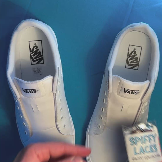 Tapestry printed shoelaces being laced up on a fresh pair of white sneakers