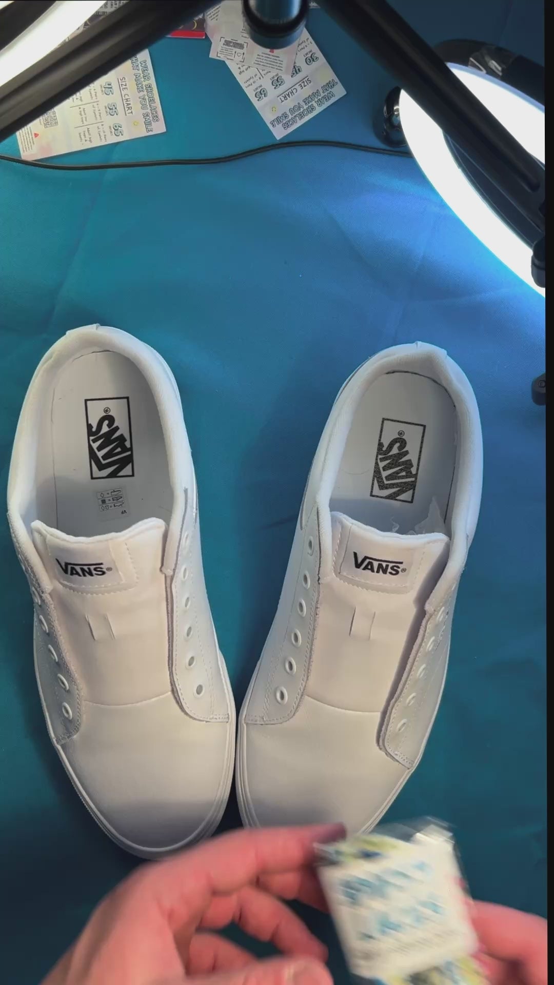 Palm tree patterned shoelaces being laced up on a fresh pair of white sneakers