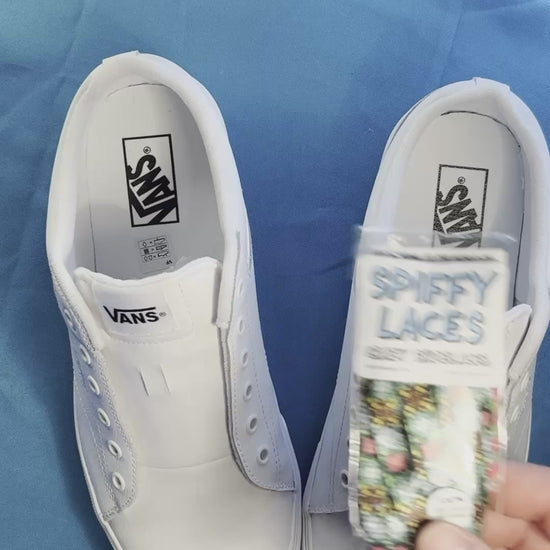 colorful crazy fun pattern shoelaces being laced up on a fresh pair of white sneakers