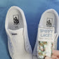 colorful crazy fun pattern shoelaces being laced up on a fresh pair of white sneakers