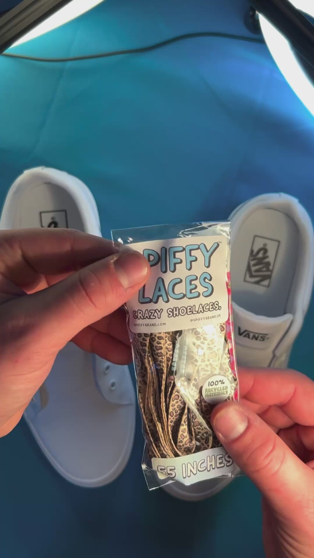 colorful leopard print shoelaces being laces up on a fresh pair of white sneakers