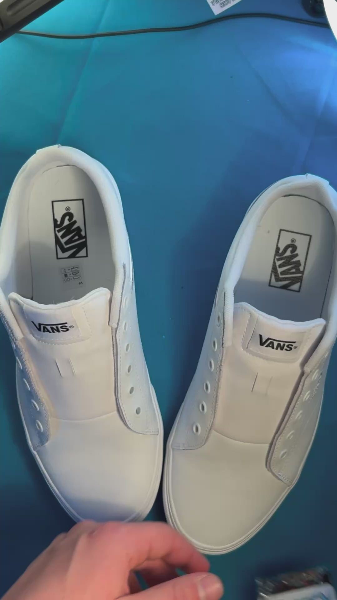 rose shoelaces being laced up on a fresh pair of white sneakers