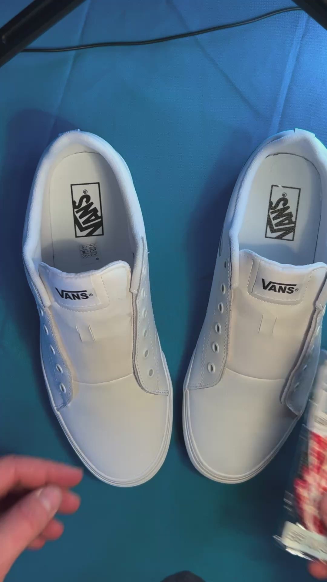 colorful heart shoelaces being laced up onto a fresh pair of white sneakers