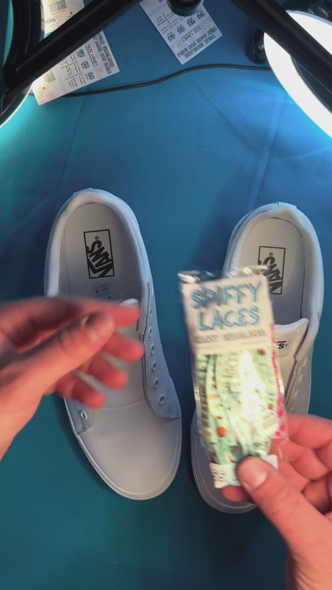 Zombie themed shoelaces being laced onto a fresh pair of white sneakers