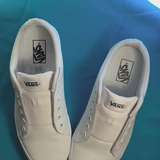 Blueberry themed shoelaces being laced up on a fresh pair of white sneakers