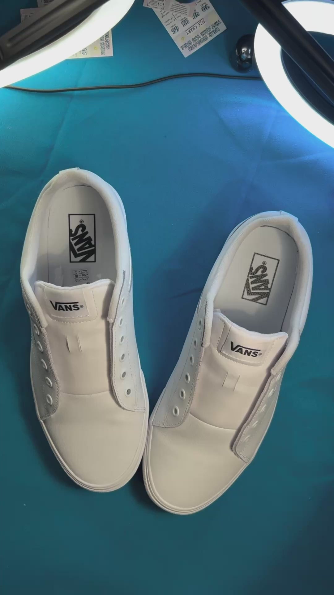Blueberry themed shoelaces being laced up on a fresh pair of white sneakers