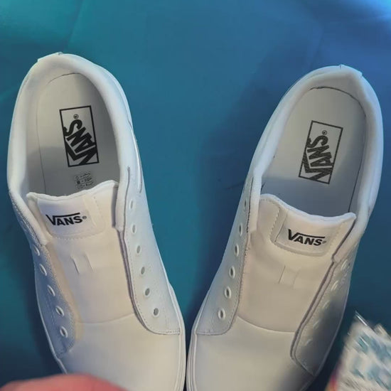 Tapestry shoelaces being laced up on a fresh pair of white sneakers