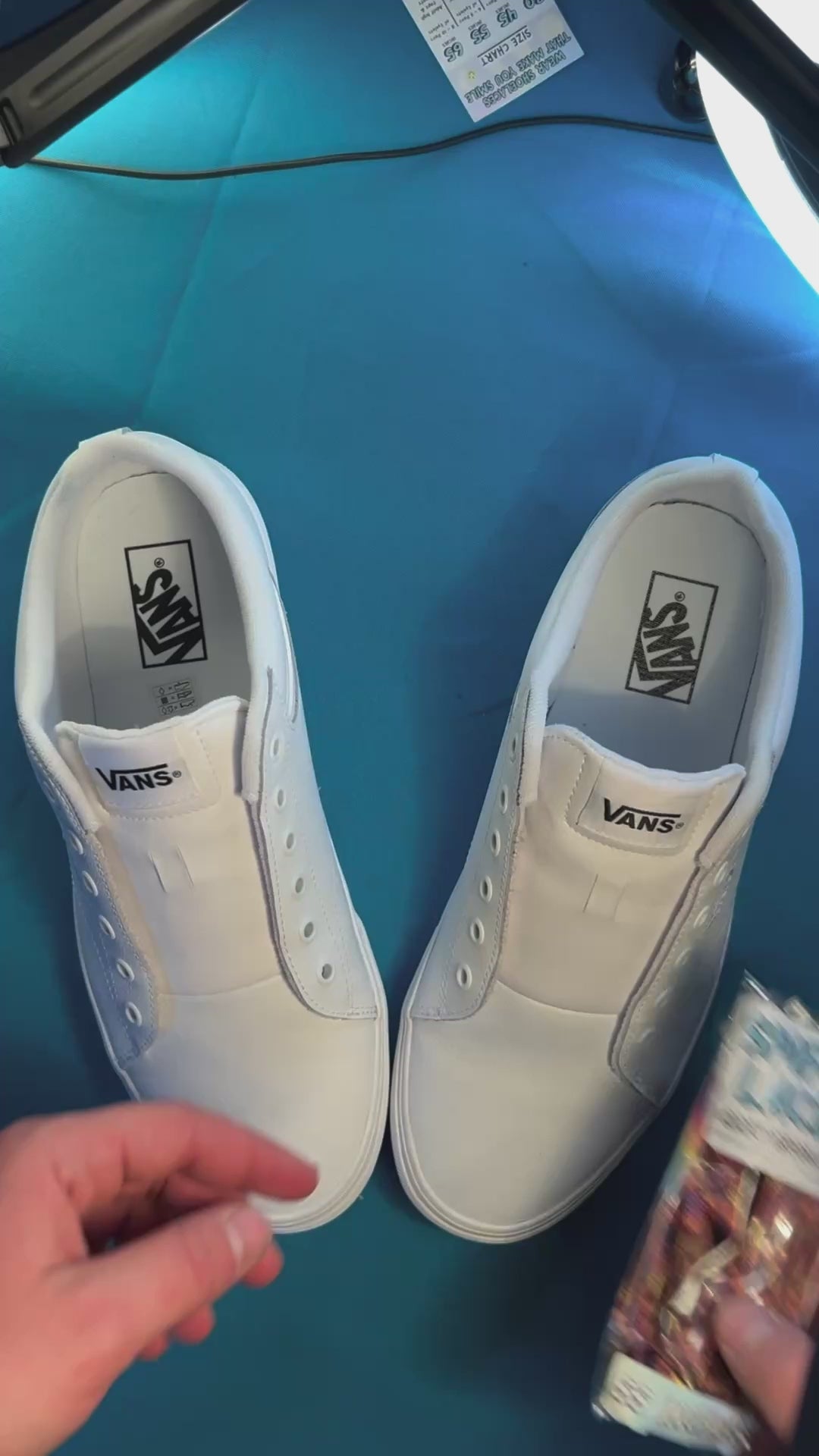 Tapestry shoelaces being laced up on a fresh pair of white sneakers