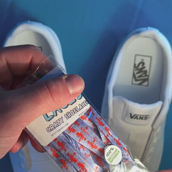 Colorful and fun lobster shoelaces being laced up on a fresh pair of white sneakers