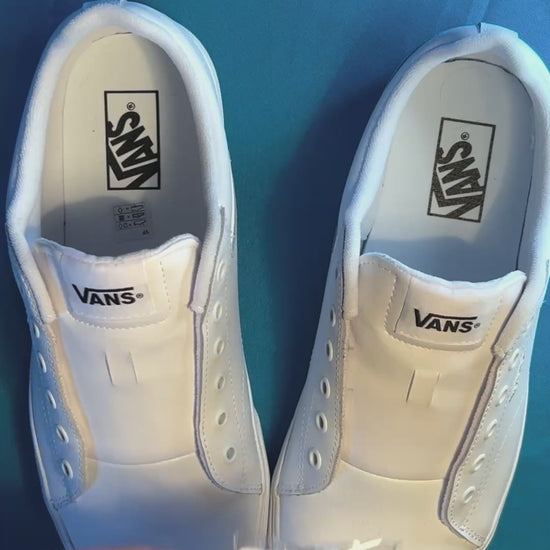 Wizard themed shoelaces being laced up on a fresh pair of white sneakers