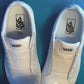 Wizard themed shoelaces being laced up on a fresh pair of white sneakers